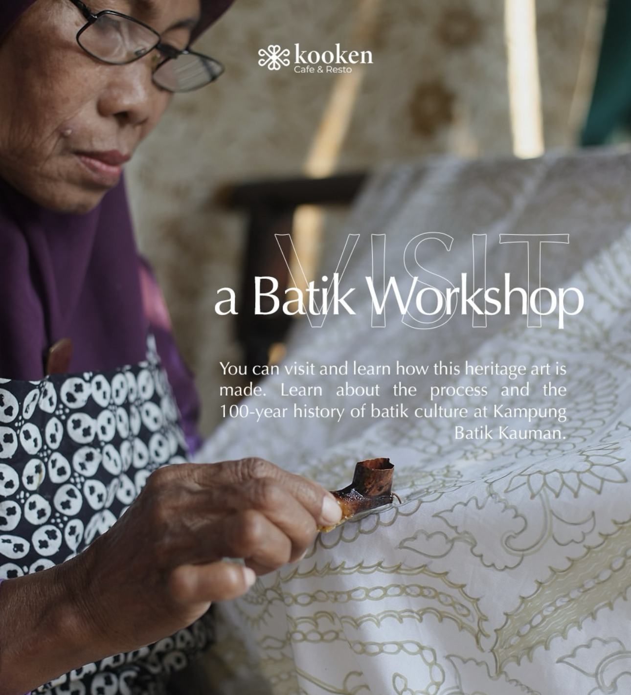 Artisan applying hot wax with a canting during a batik workshop